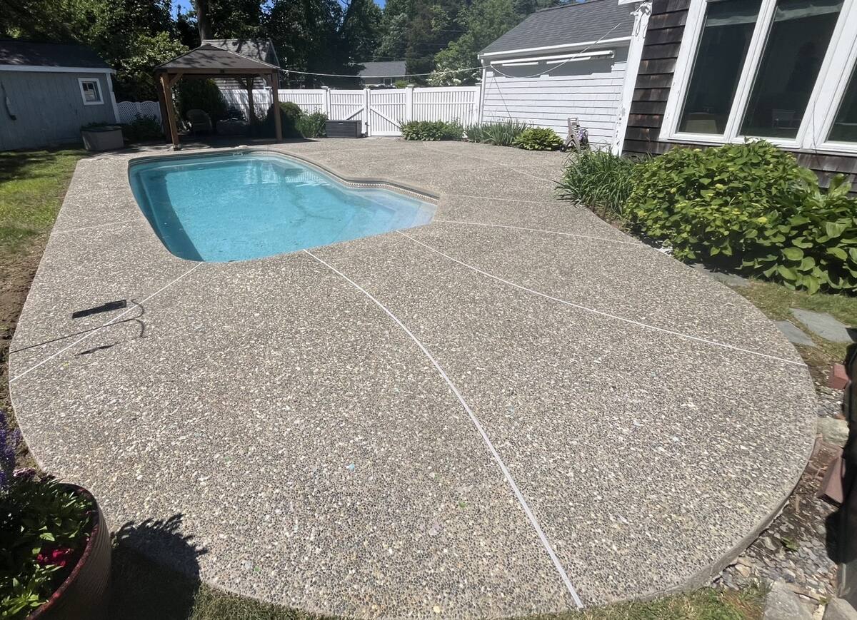 Freshly cleaned exposed aggregate pool deck by H2WOAH