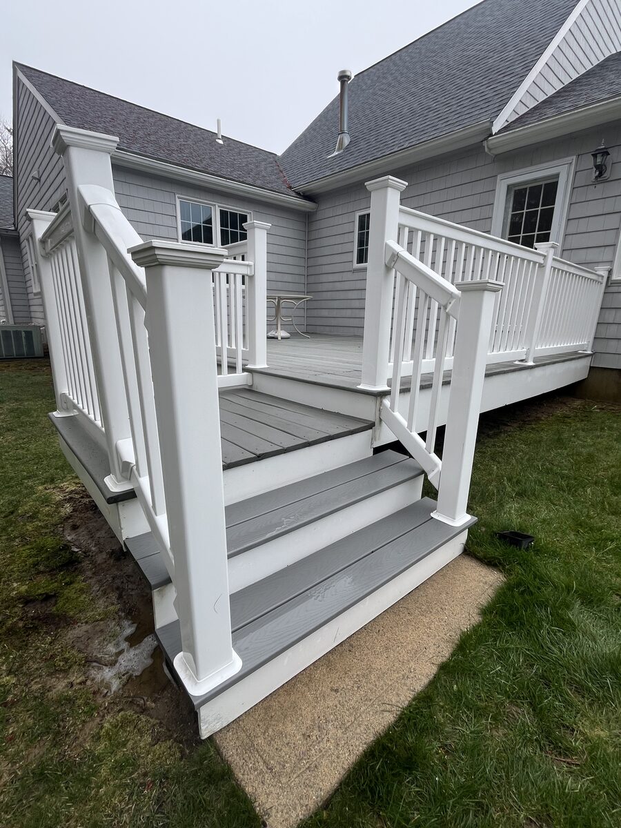 After backyard composite deck cleaning in Marshfield MA by H2WOAH Exterior Cleaning showing a clean refreshed deck