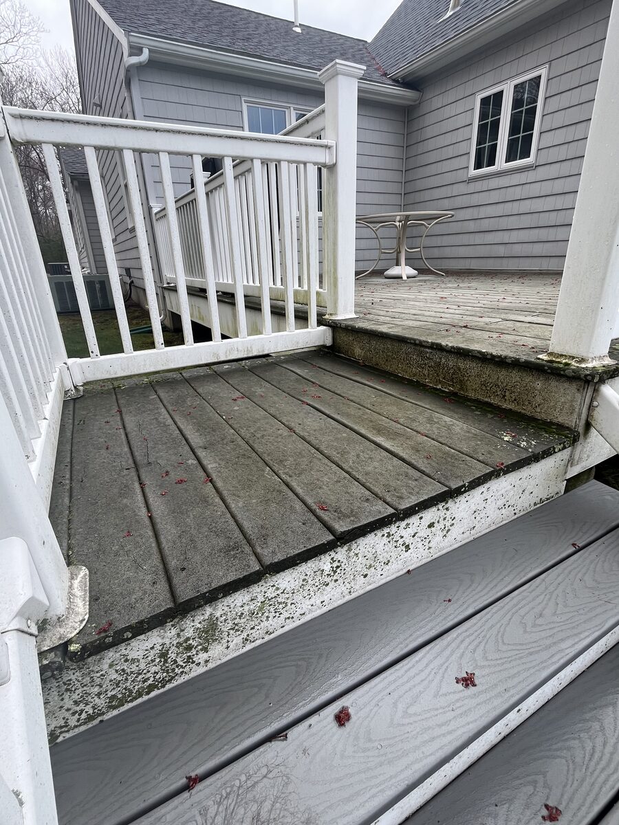 Before backyard composite deck cleaning in Marshfield MA showing outdoor buildup on the deck