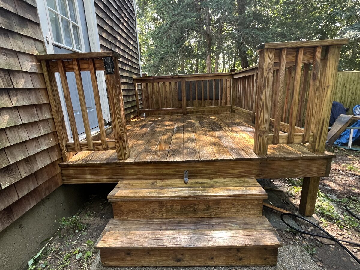 After wood deck cleaning in Marshfield MA by H2WOAH Exterior Cleaning showing a cleaner refreshed wood deck