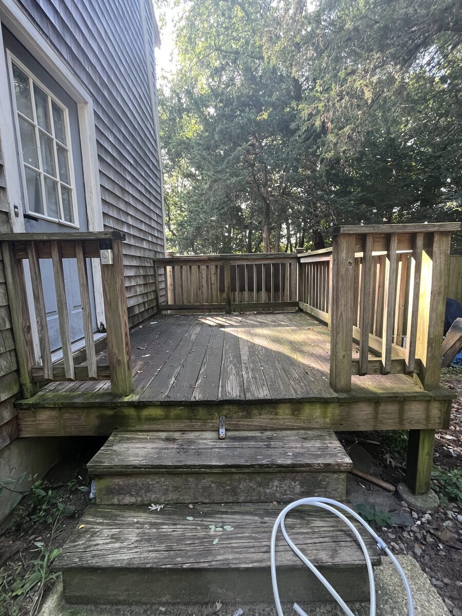 Before wood deck cleaning in Marshfield MA showing weathering and organic buildup