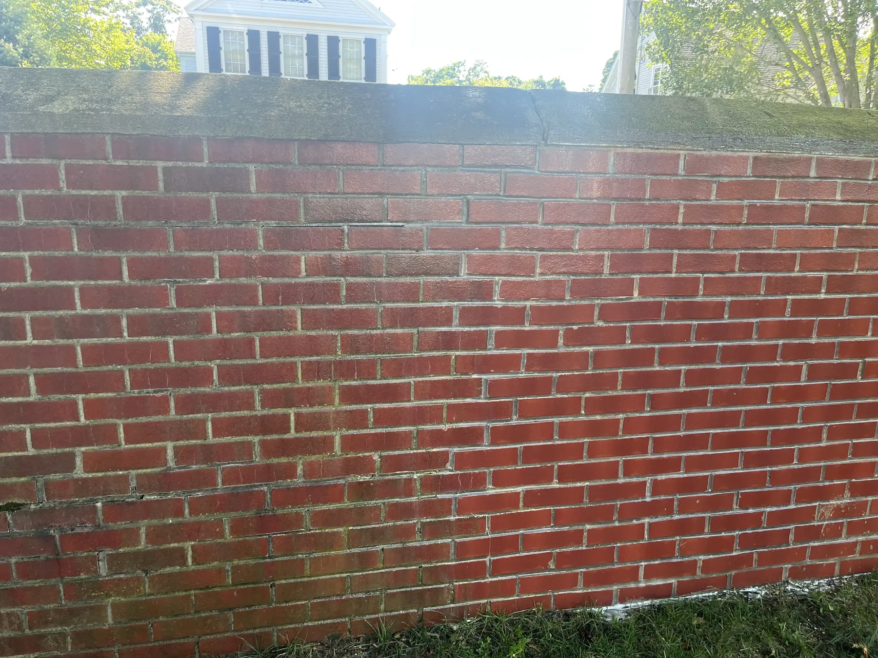 Brick wall soft washing in Plymouth MA, red masonry wall looking brighter after exterior cleaning by H2WOAH