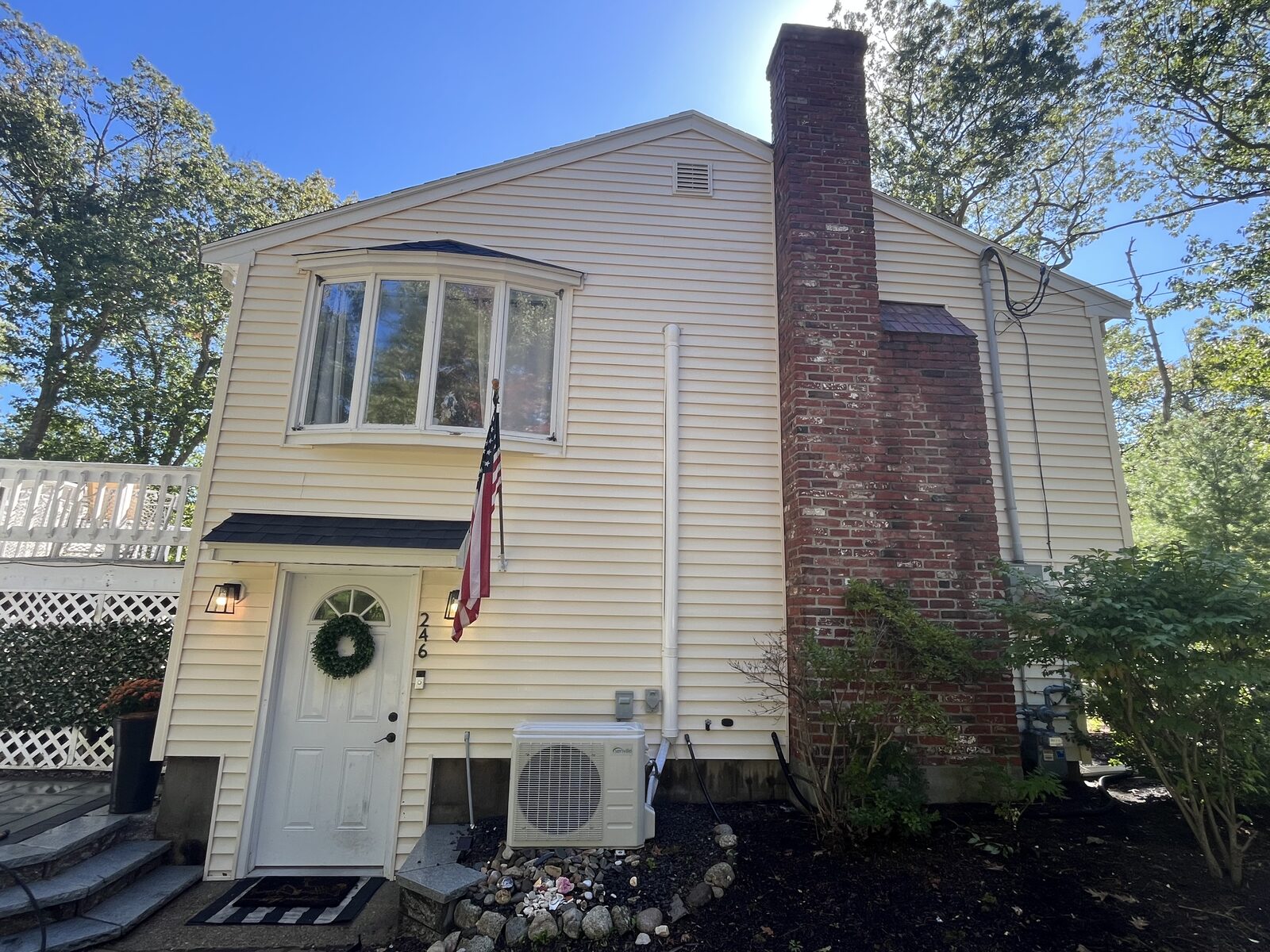 After vinyl house wash in Hanover MA showing clean mildew-free siding cleaned with safe pressure washing and soft washing methods