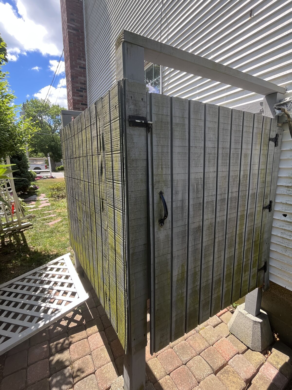 Outdoor structure with algae and mildew buildup before cleaning in Marshfield MA