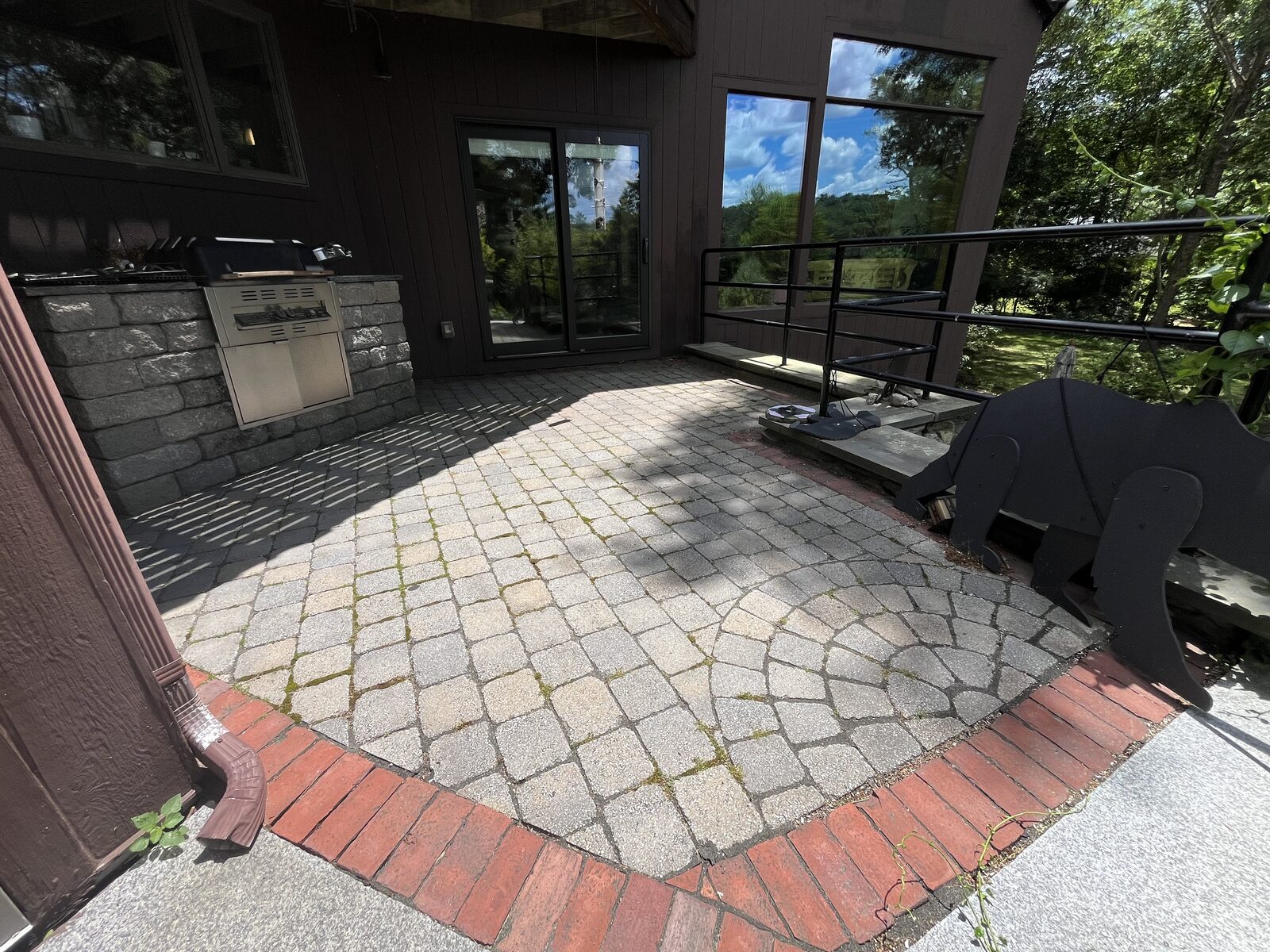 Moss removal from pavers in Marshfield MA, paver sitting area with algae before cleaning