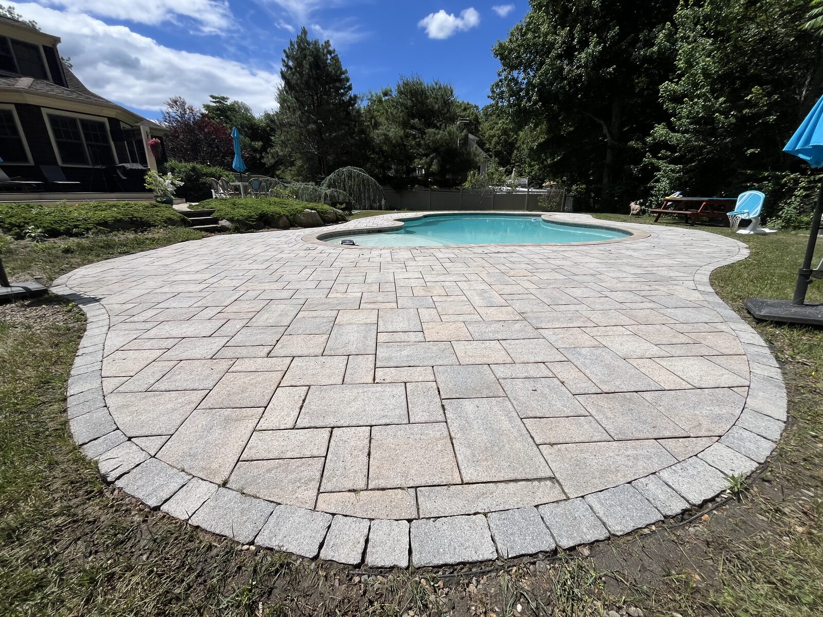 Paver pool patio cleaning in Scituate, MA by H2WOAH Exterior Cleaning