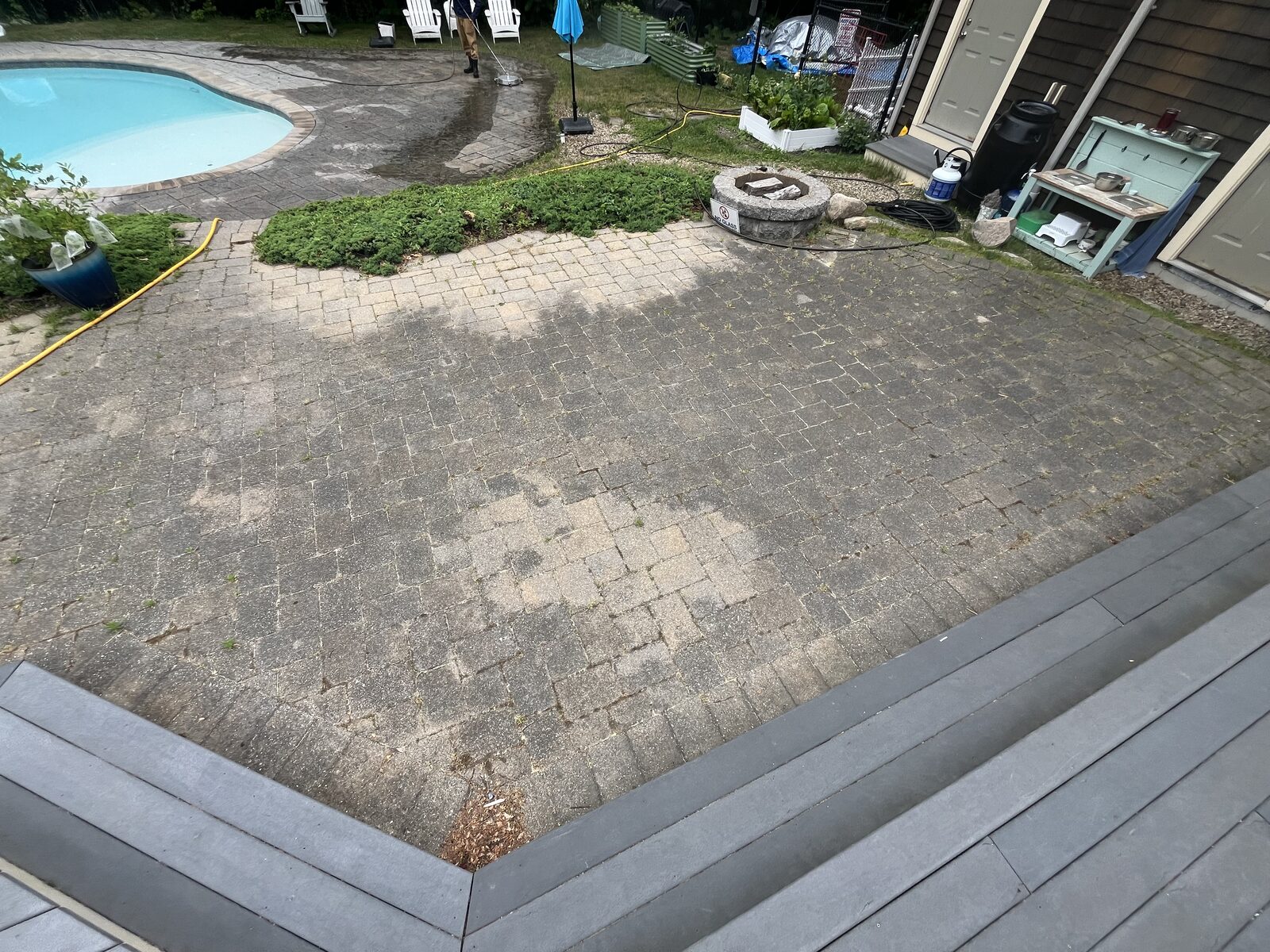Before and after paver patio cleaning in Scituate MA by H2WOAH Exterior Cleaning, algae and grime on pavers near the deck before cleaning