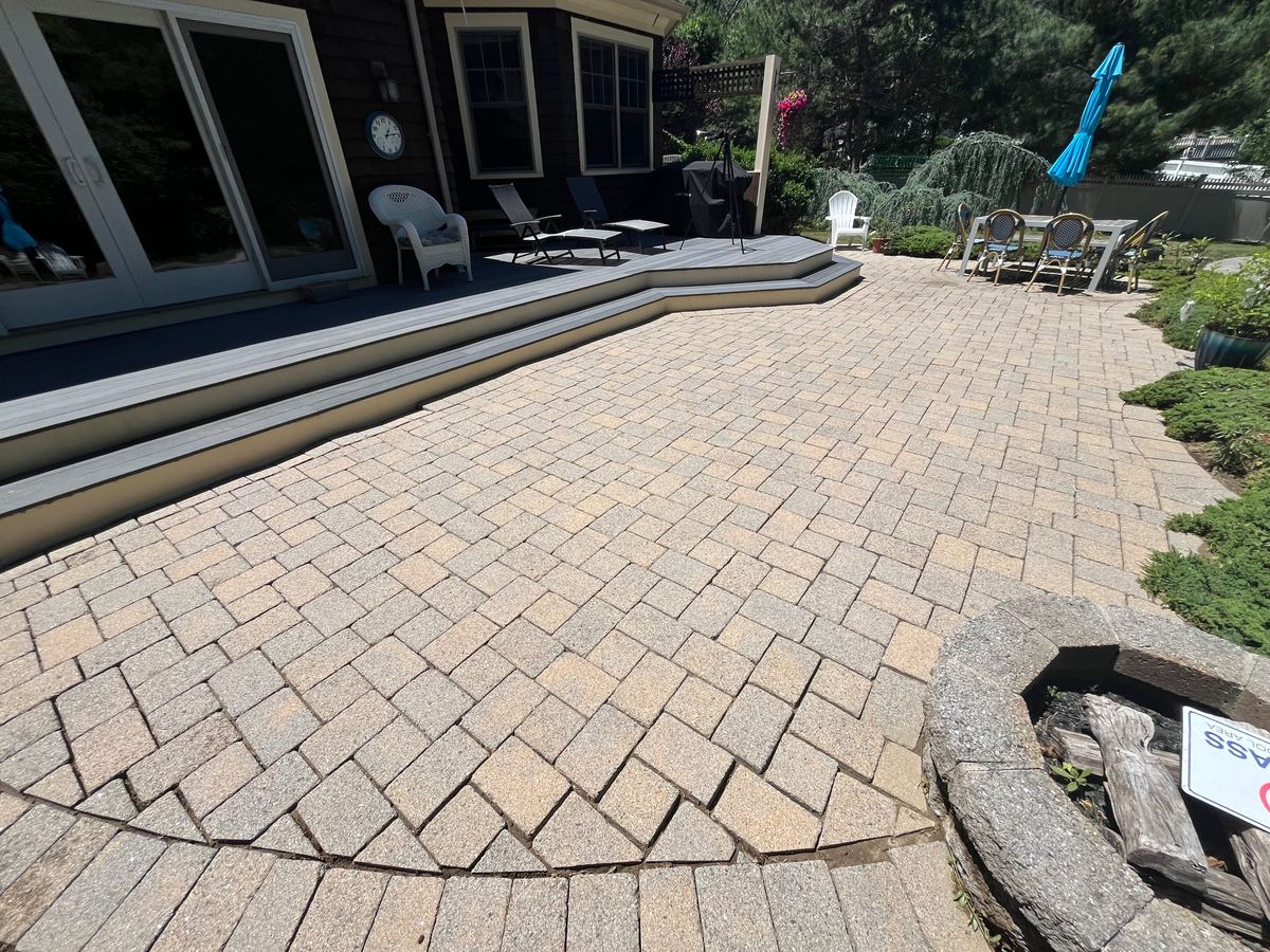 Before paver pool patio cleaning in Scituate MA showing grime and weathering on the pavers