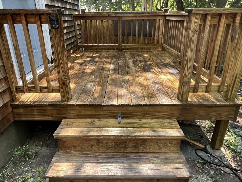 Deck cleaning result — restored wood deck