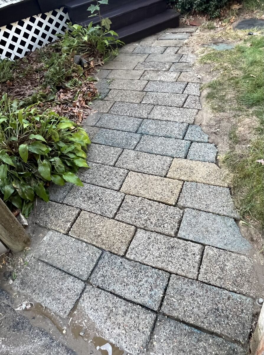 After walkway pressure washing in Weymouth MA by H2WOAH Exterior Cleaning showing clean stone pavers